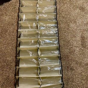 Over door shoe rack holds 24 pairs of shoes, dust free and a space saver!